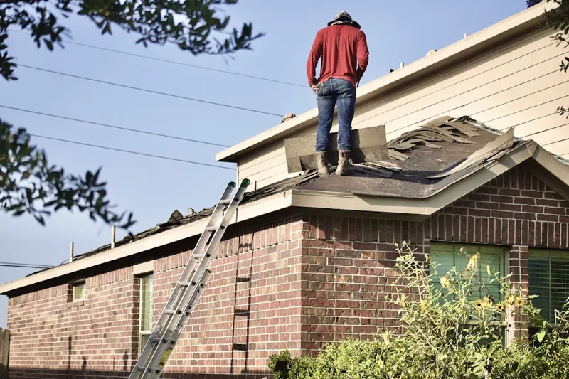 Professional roofer working on a residential roof in Baldwin Hills Estates